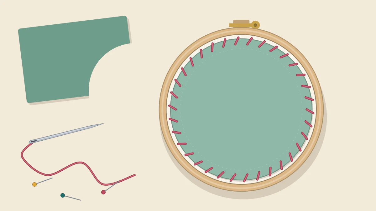 Back of an embroidery hoop covered with a felt circle sewn on with small stitches around its edge