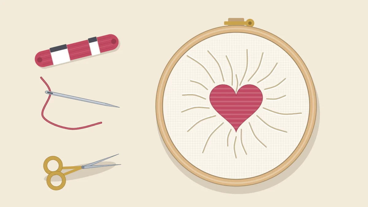 Embroidery hoop with a satin-stitched heart and wrinkles in the fabric radiating from it