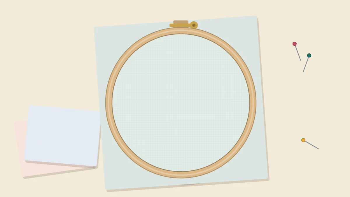 Wooden embroidery hoop holding plain taut fabric with the screw at the top and the square fabric edges extending past the hoop